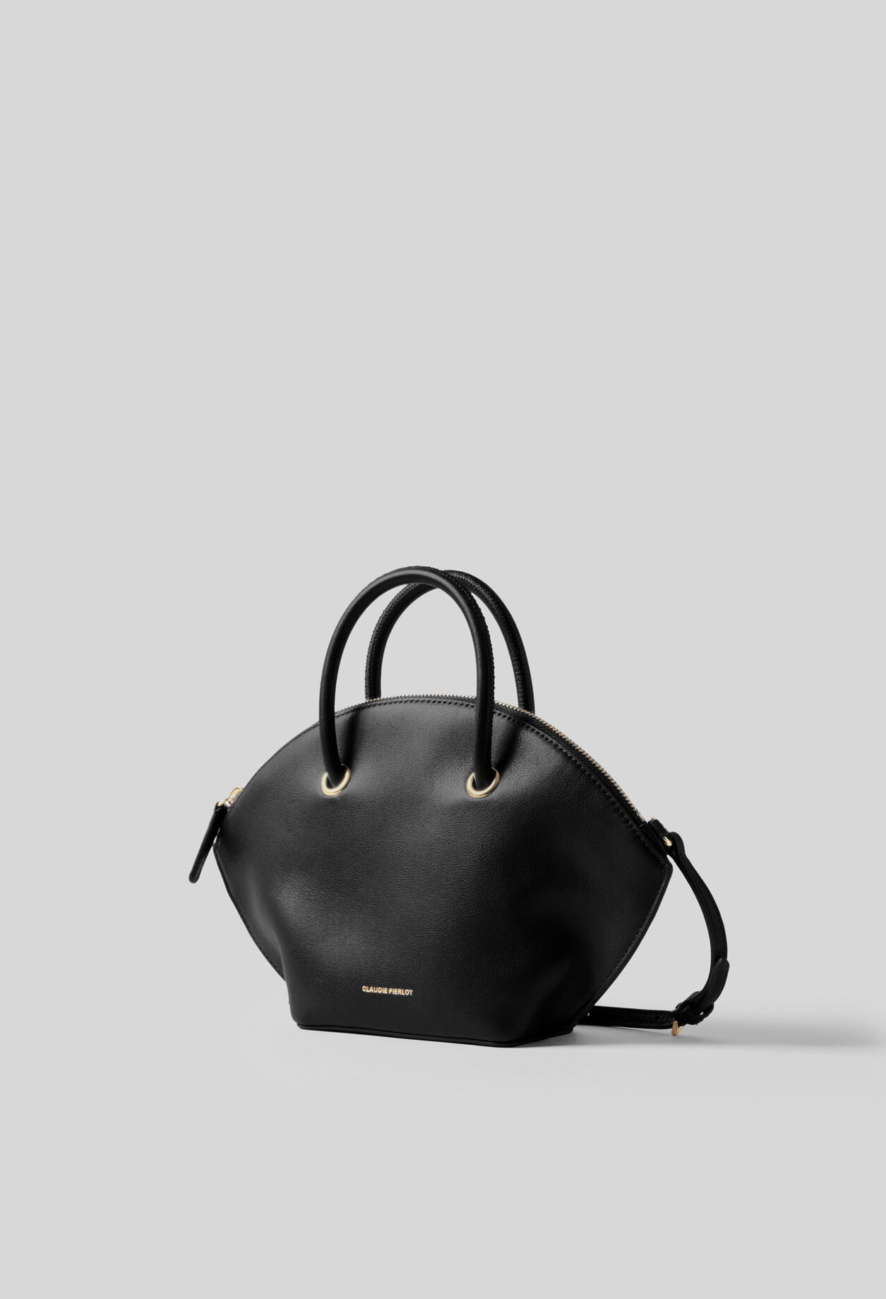 Glattledertasche mit Goldringen