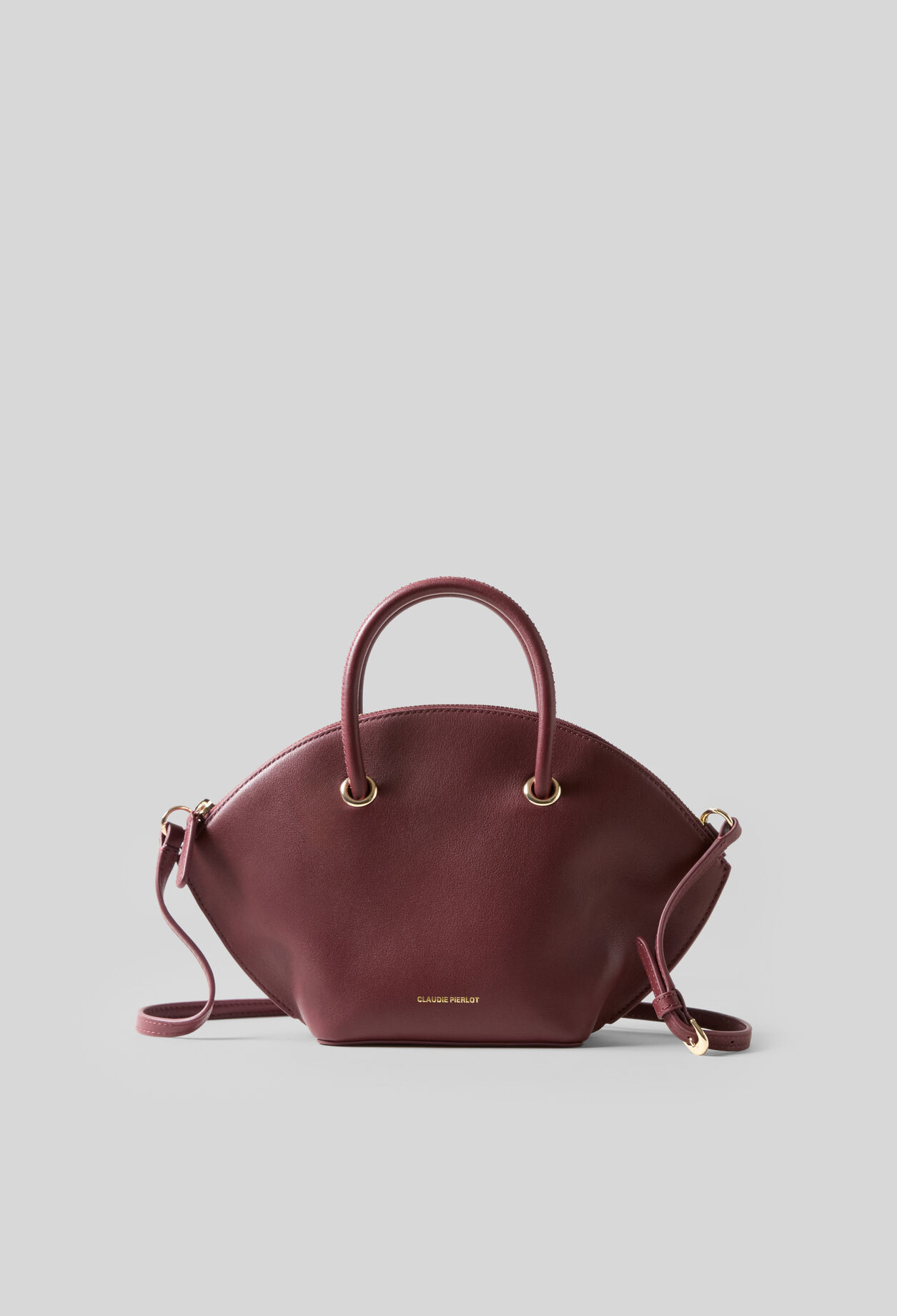 Glattledertasche mit Goldringen