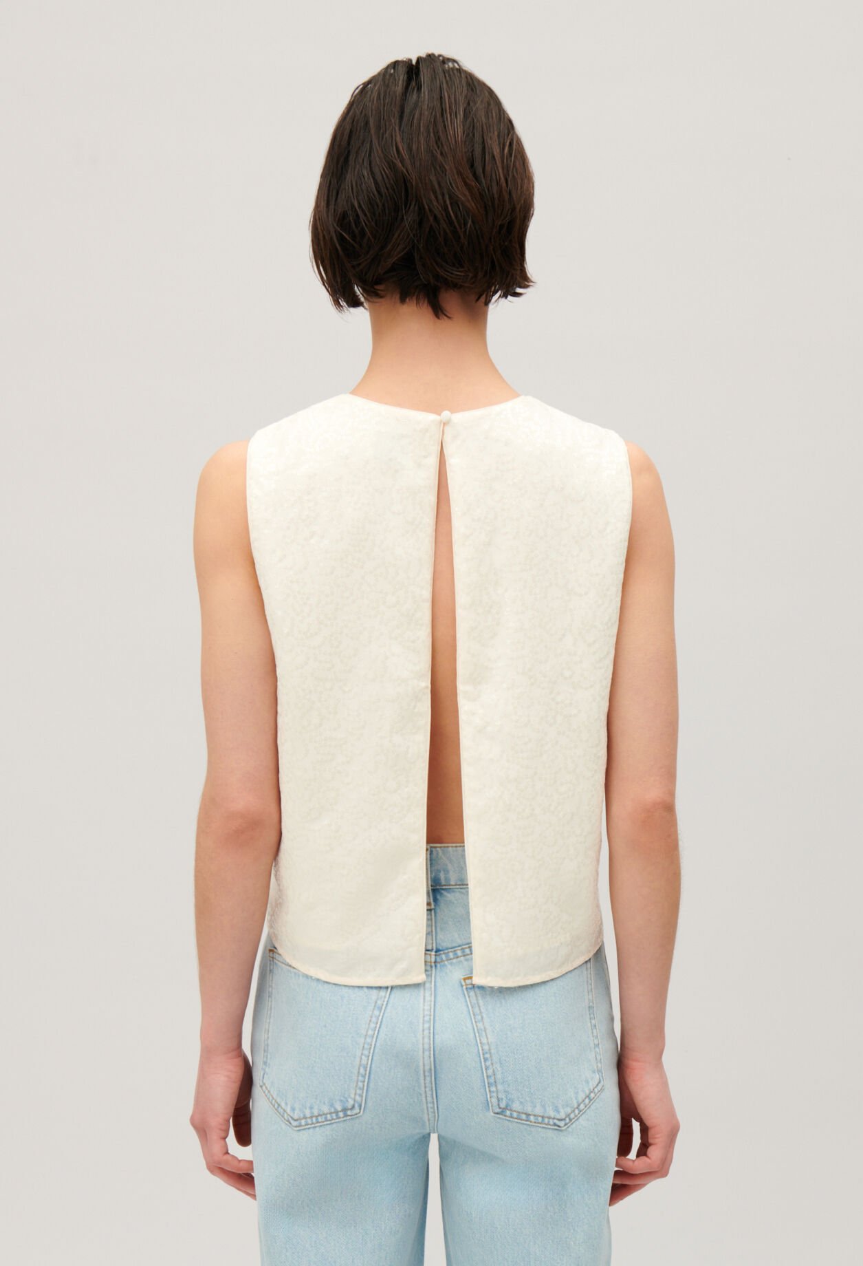 Ärmelloses Top mit Paillettenbesatz Ecru