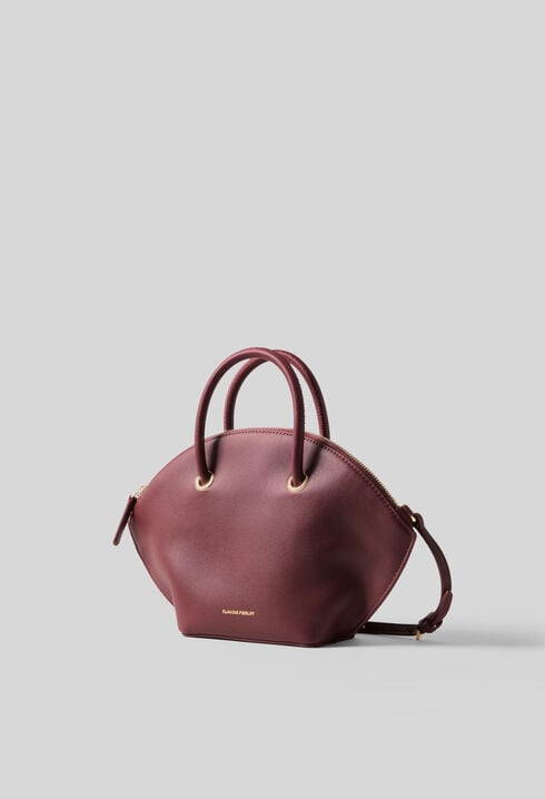 Glattledertasche mit Goldringen
