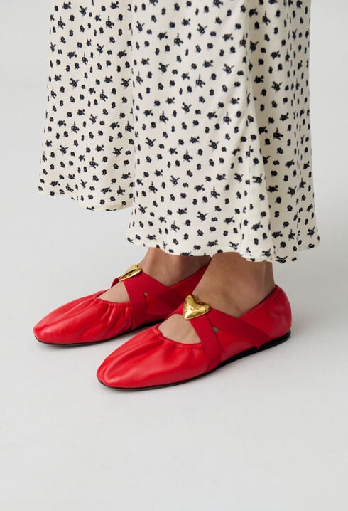 Ballerinas goldener Lederherz