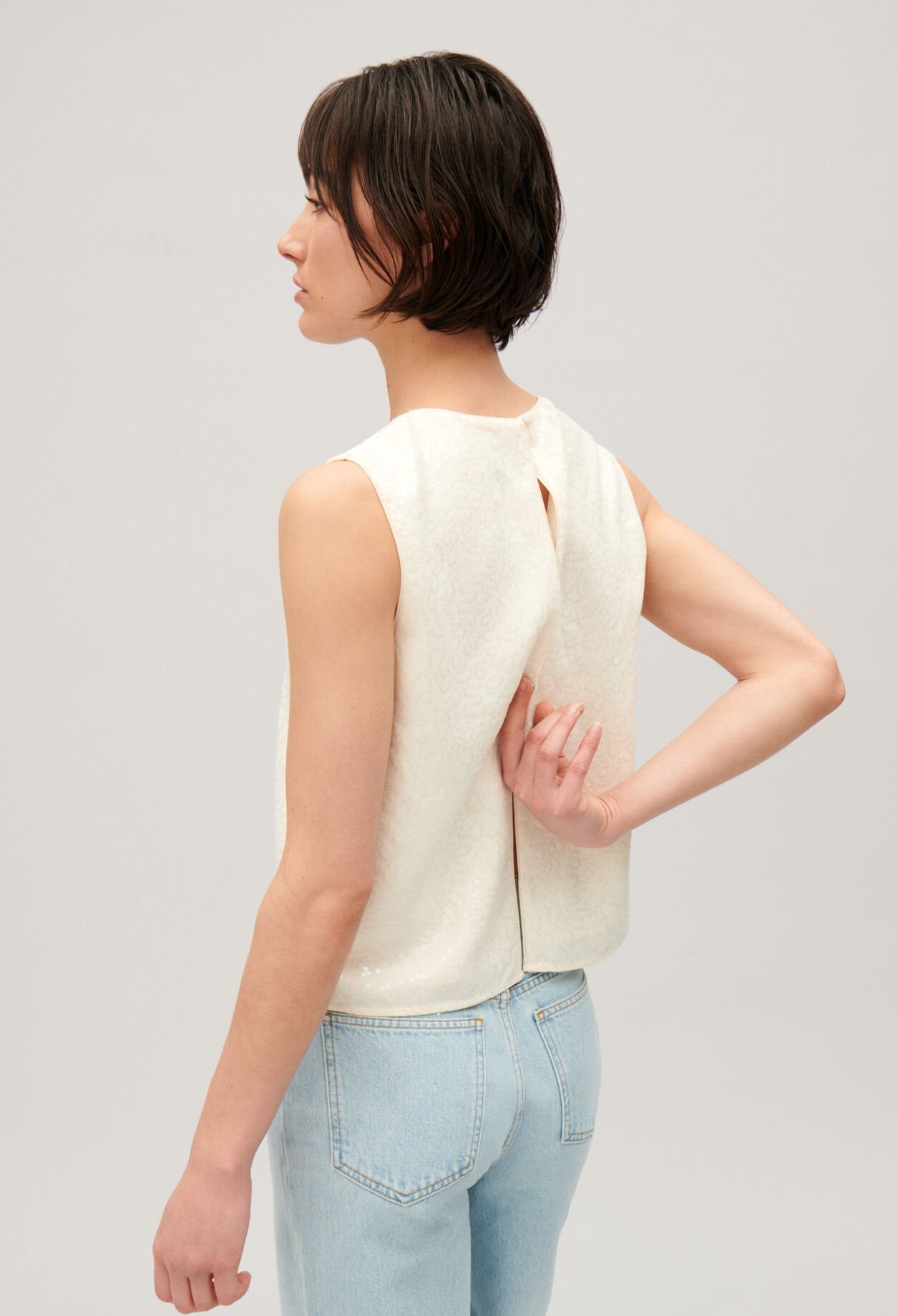 Ärmelloses Top mit Paillettenbesatz Ecru