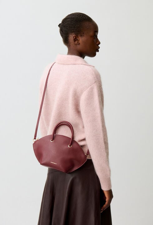 Glattledertasche mit Goldringen